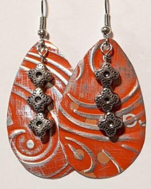 Red and silver egg shaped earrings.